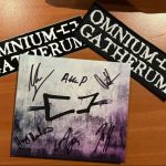 Omnium Gatherum Bandpaket mit signierter CD „May the Bridges We Burn Light the Way“ (2025) plus Patch & Sticker. Jetzt Omnium Gatherum Bandpaket sichern!
